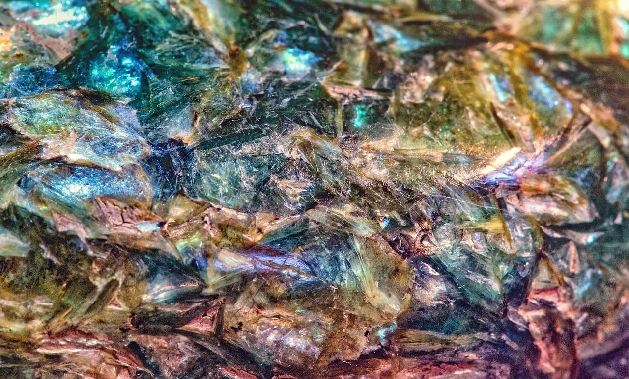 What Is the Difference Between Andalusite and Axinite?