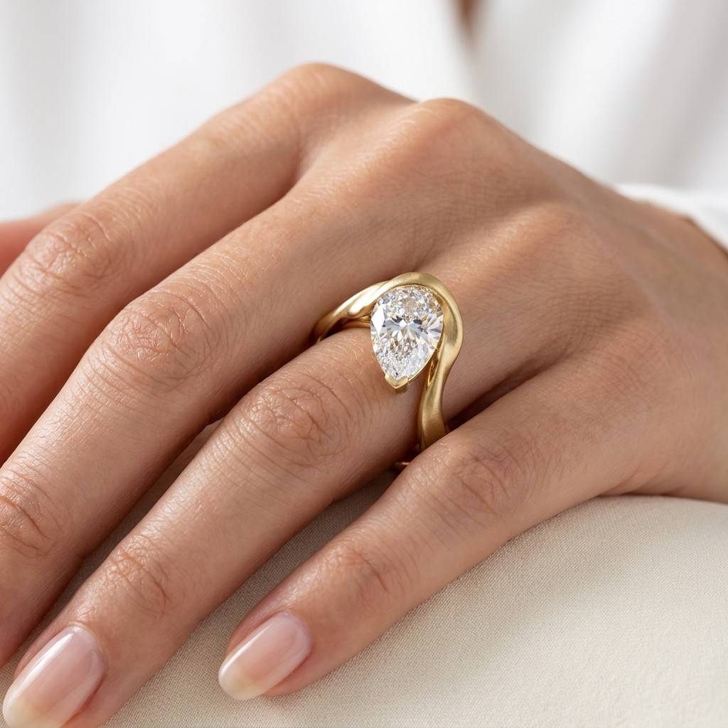 Contemporary_Waved_Pear_Uneven_Diamond_Engagement_Ring_yellow_gold.jpg