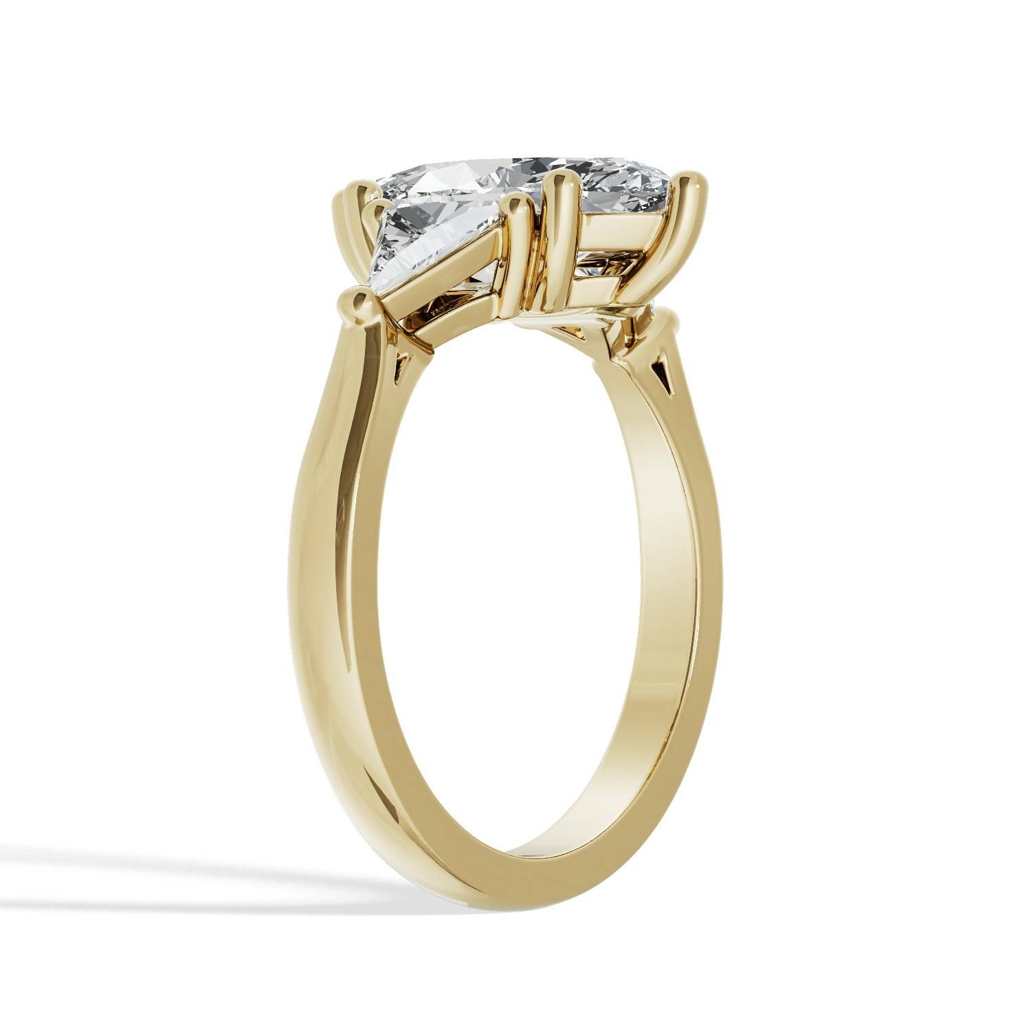 Marquise_Trilogy_Diamond_Engagement_Ring_with_Triangle_Sides_hero_yellow_gold