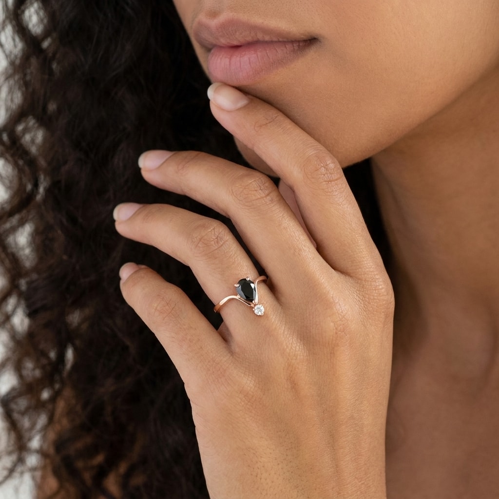 Black_Diamond_Pear_and_Small_Diamond_Engagement_Ring_On_Model