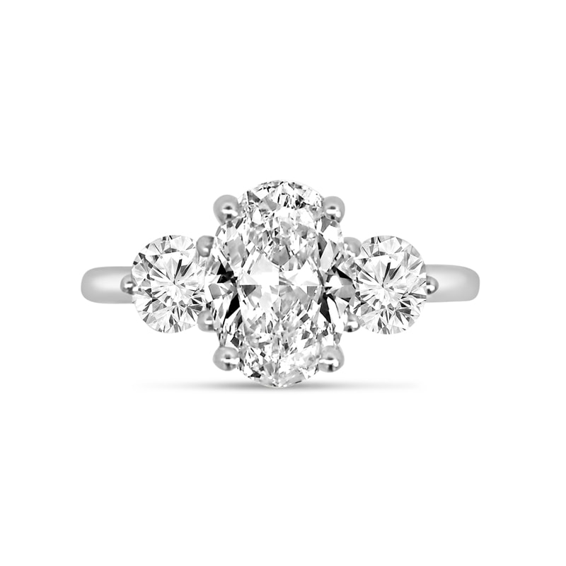 Oval Side Rounds Crossed Trilogy Diamond Engagement Ring view 1