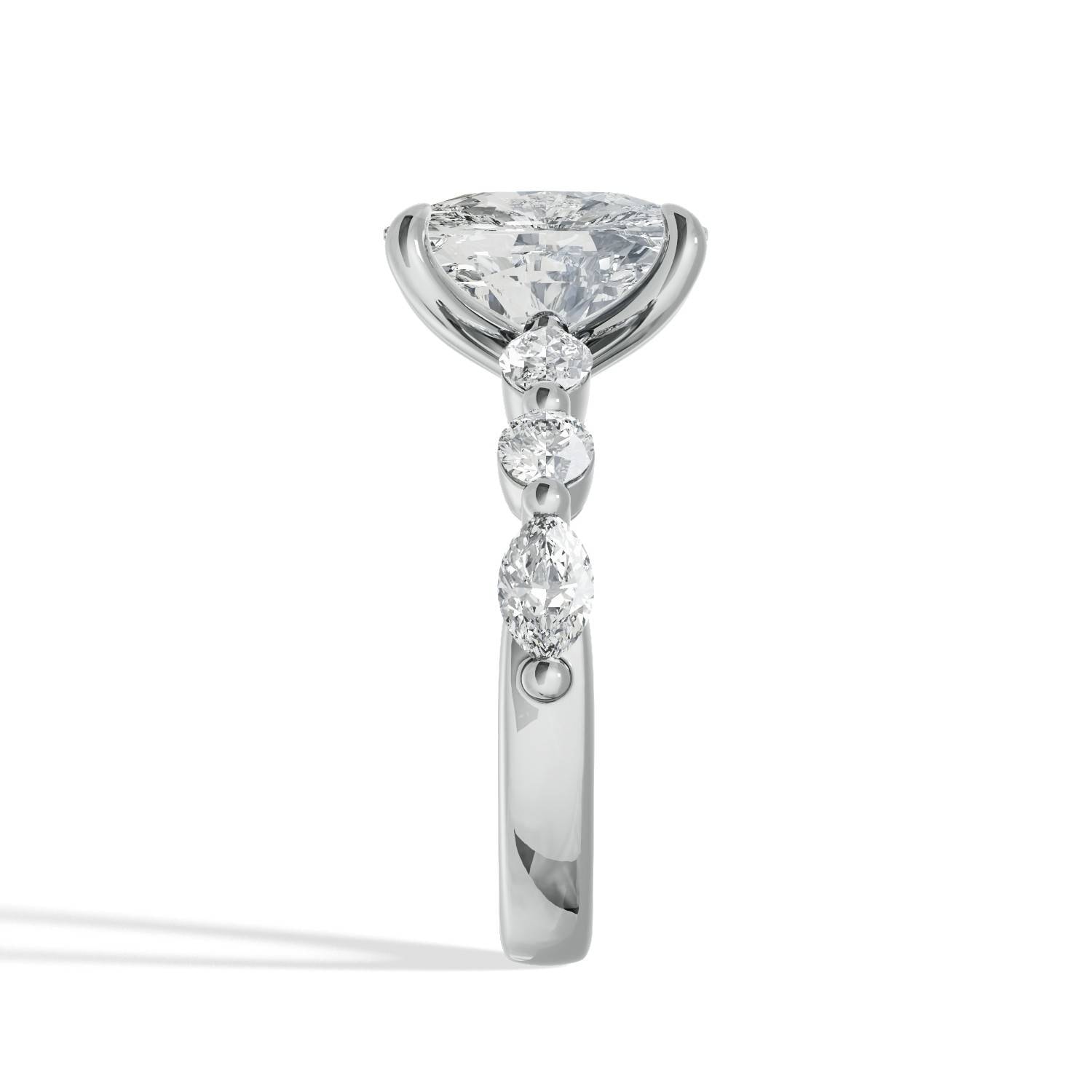 Elongated_Cushion-Cut_Diamond_Ring_with_Marquise_and_Round_Side_Diamonds_side_view_platinum.jpg