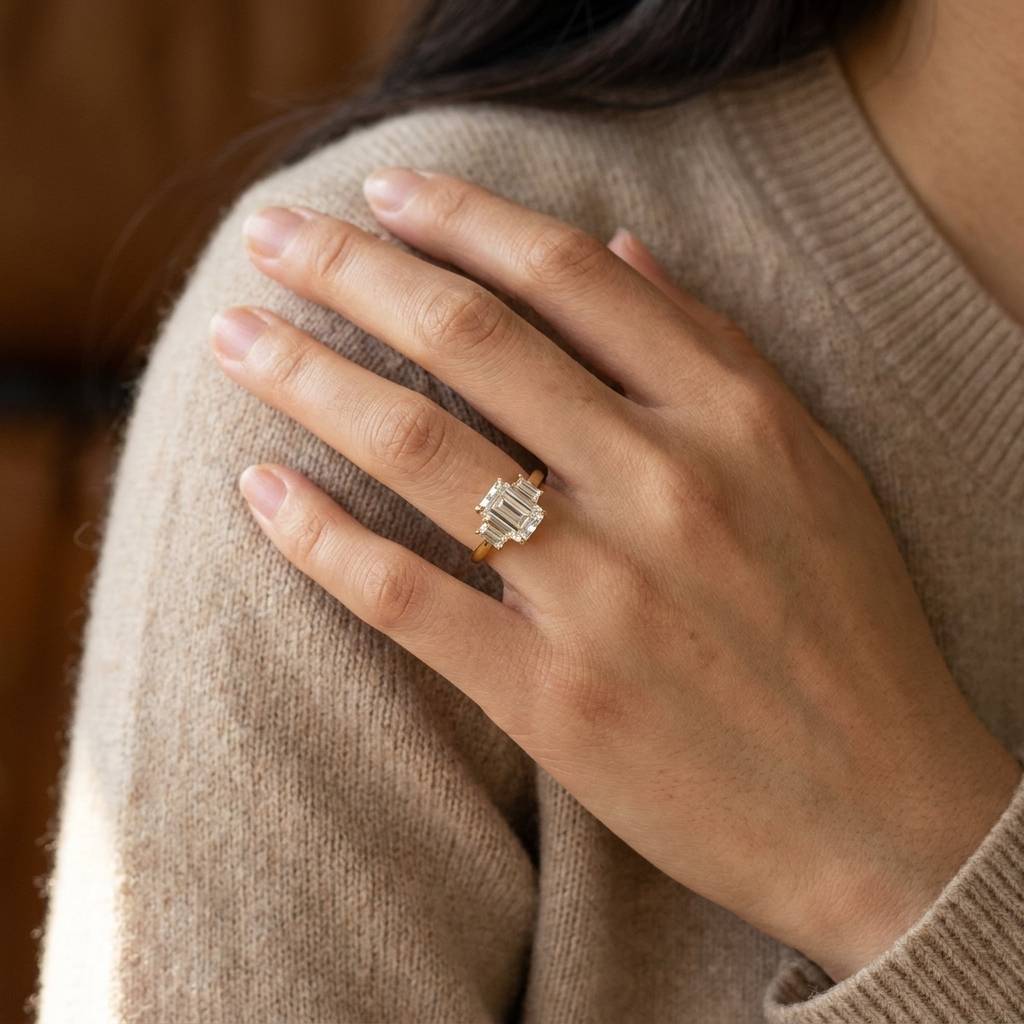 Emerald_Shape_Baguette_Side_Trilogy_Lab_Grown_Yellow_Gold_Diamond_Engagement_Ring_On_Hand