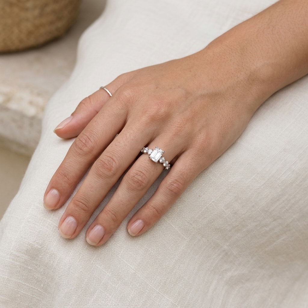 Emerald_Shape_Seven_Stones_Design_Lab_Grown_Diamond_Engagement_Ring_On_Hand