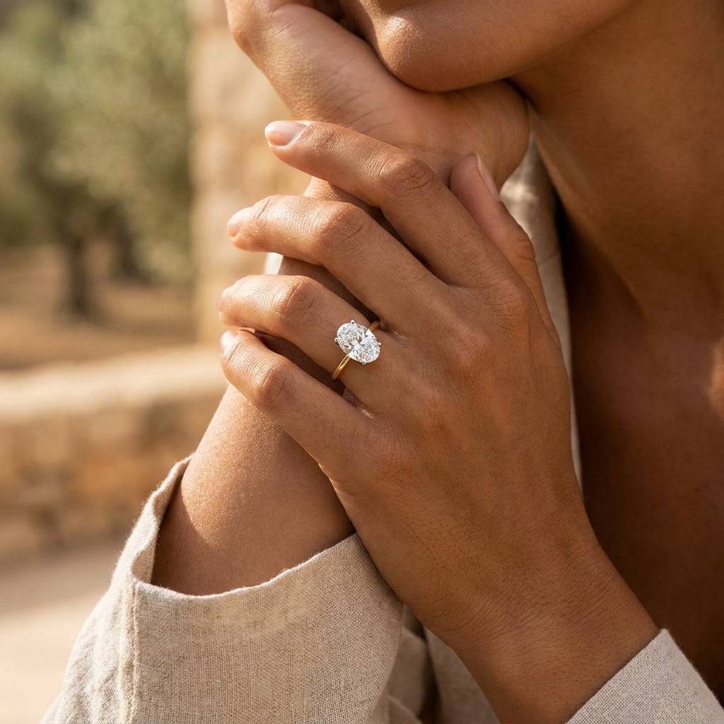 Hailey_Bieber_Oval_Hidden_Halo_Solitaire_Diamond_Engagement_Ring_On_Hand