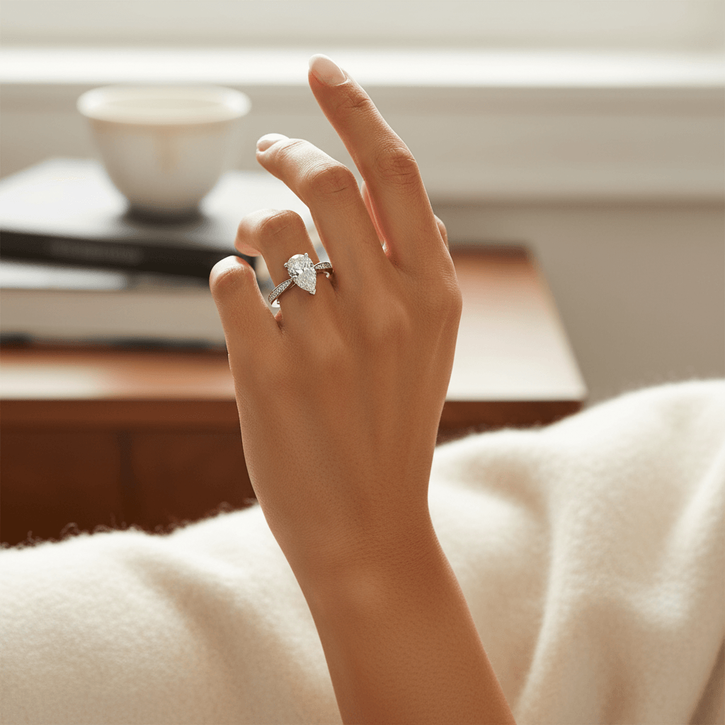 Pear_Shape_Diamond_Tapered_Pave_Setting_Engagement_Ring_On_Hand