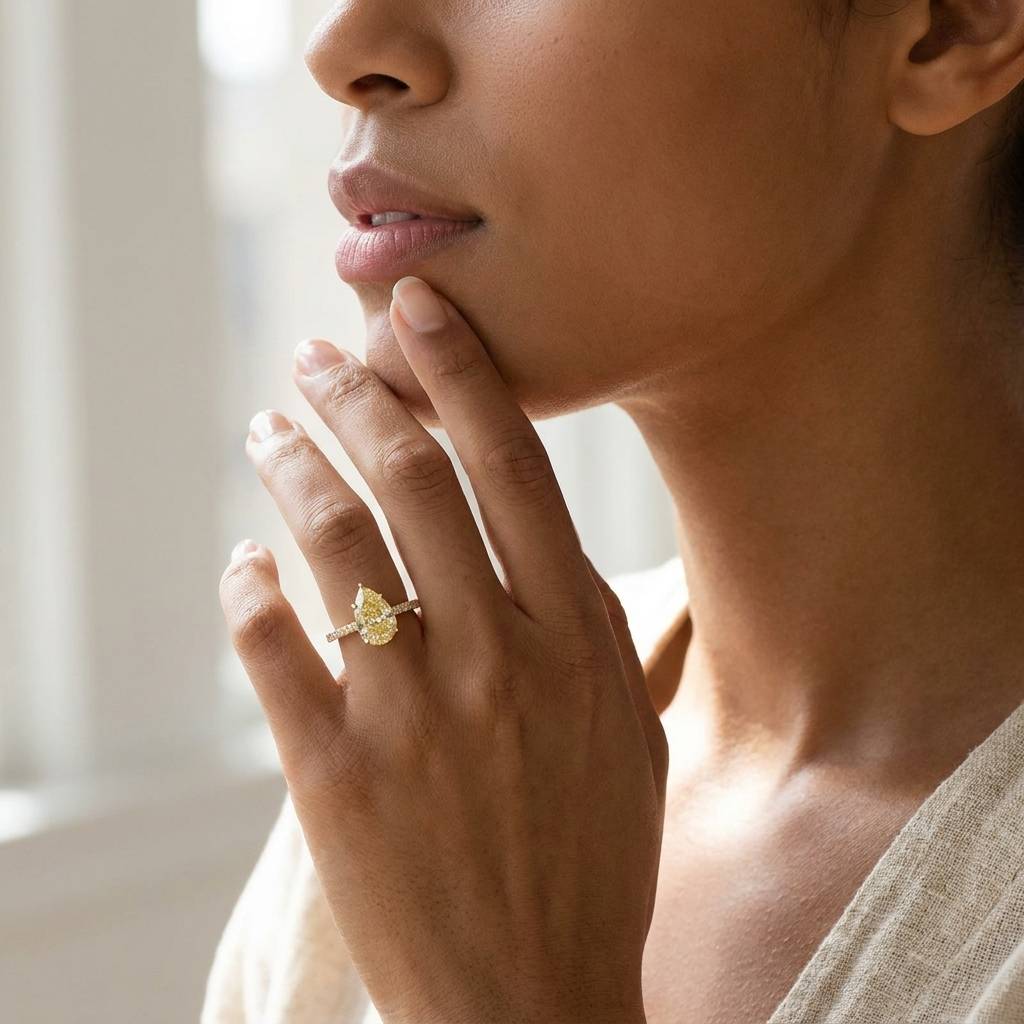 Pear_Shape_Lab_Grown_Yellow_Diamond_Engagement_Ring_On_Model