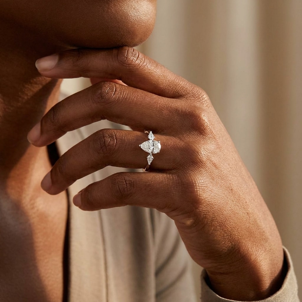 Pear_and_Kite_Side_Stones_Diamond_Engagement_Ring_On_Hand