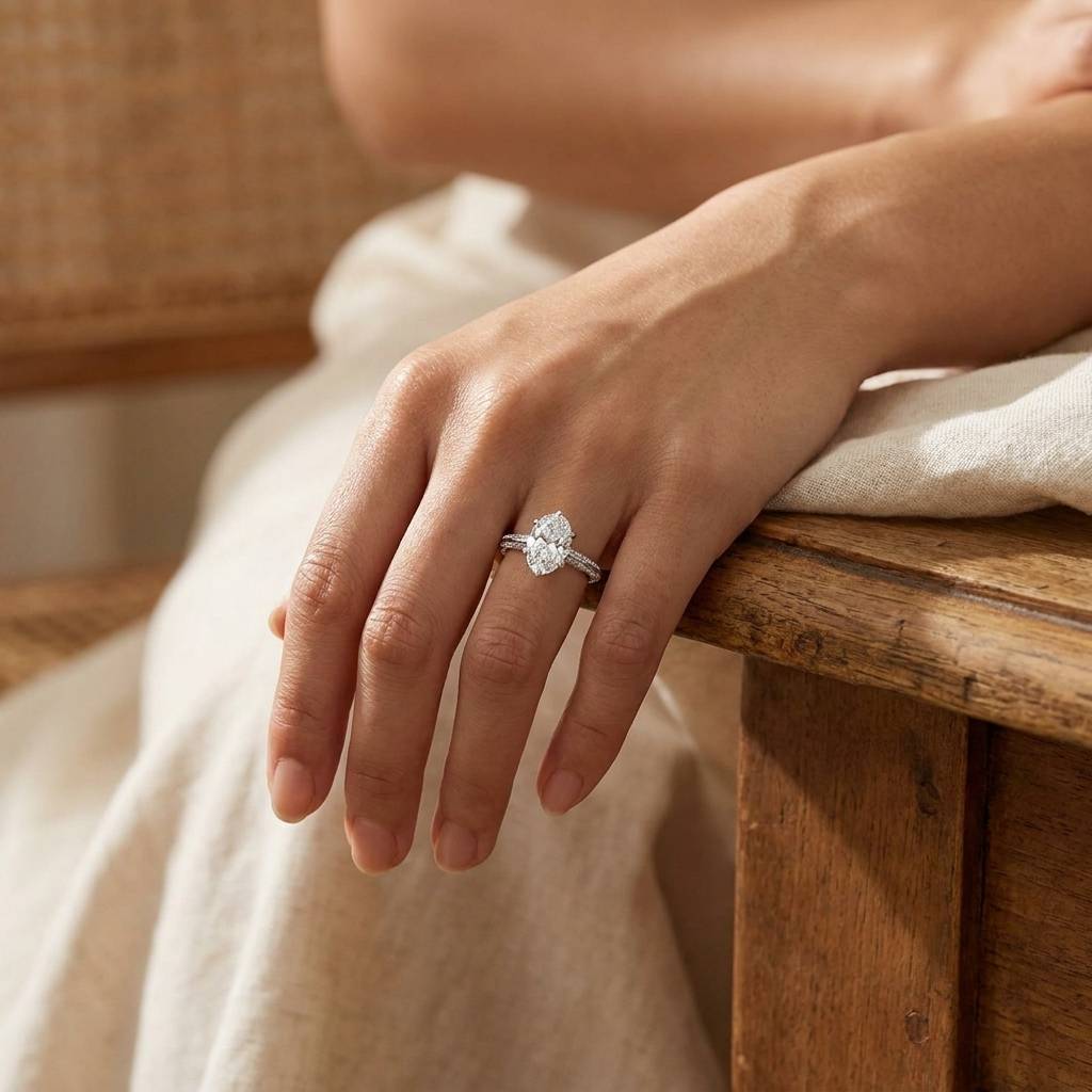 Six_Claw_Knife_Edge_Oval_Pave_Diamond_Engagement_Ring_On_Hand