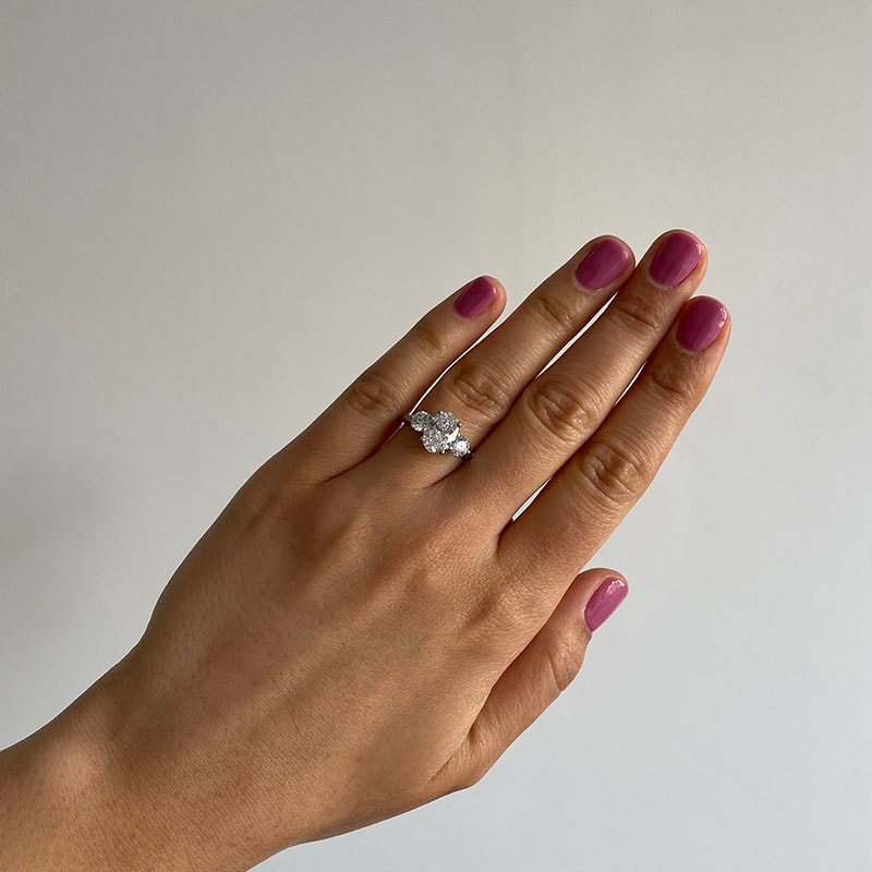 Oval Side Rounds Crossed Trilogy Diamond Engagement Ring view 6