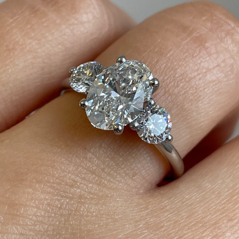 Oval Side Rounds Crossed Trilogy Diamond Engagement Ring view 7