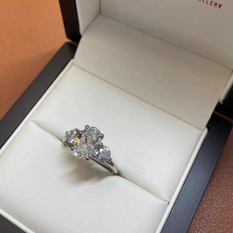 Oval Side Rounds Crossed Trilogy Diamond Engagement Ring view 8