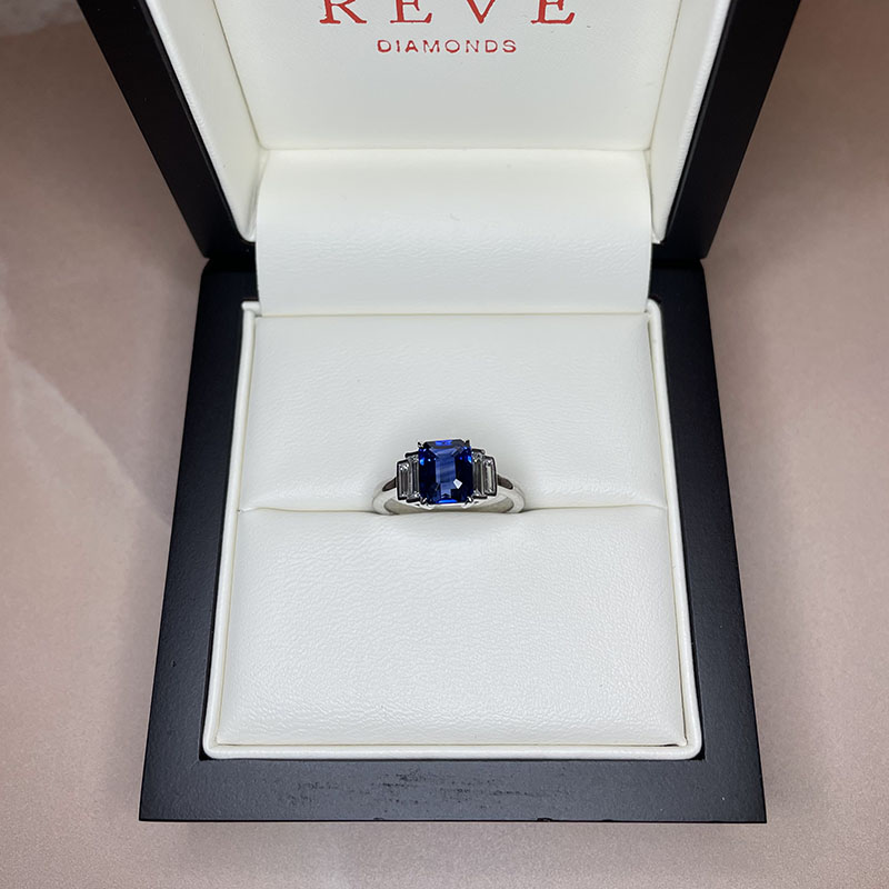 Blue Sapphire Emerald Shape and Side Baguettes Engagement Ring