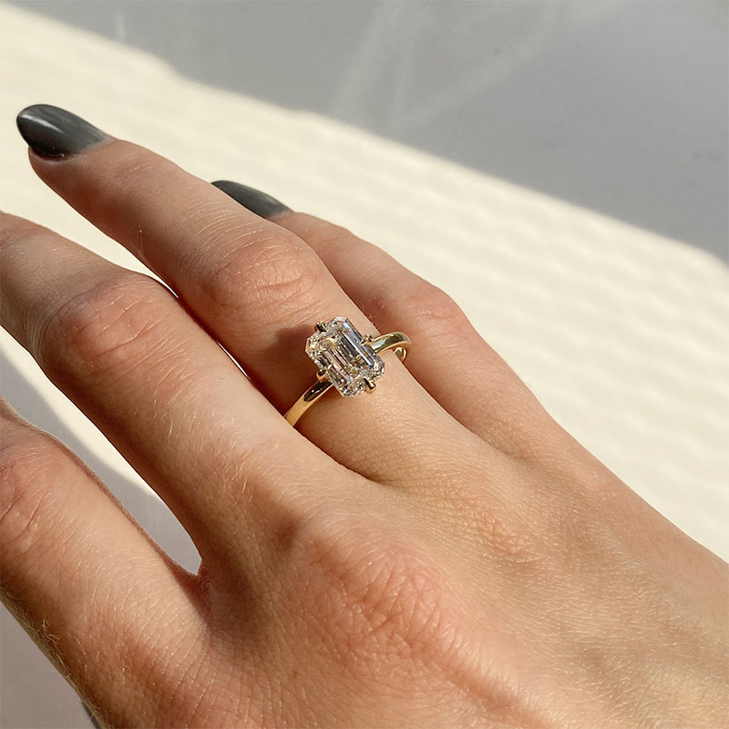 Compass Setting Emerald Shape Diamond Engagement Ring