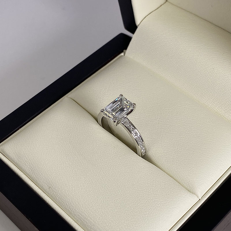 Channel set emerald cut diamond ring top