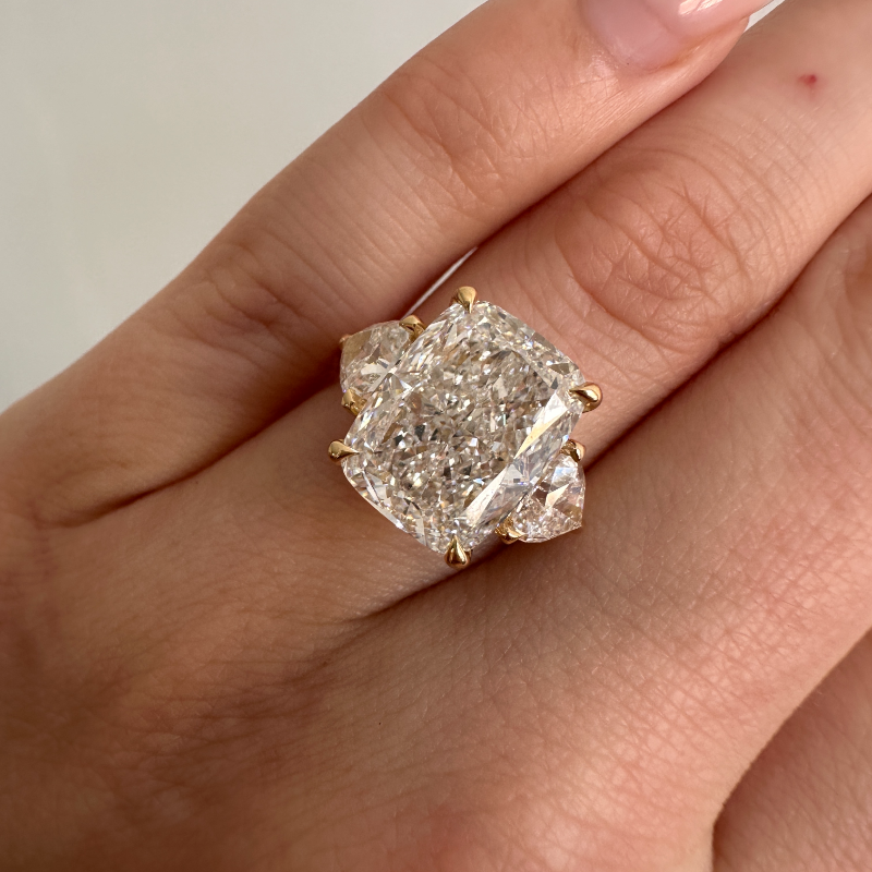 Radiant cut diamond with trillion side stones hot sale