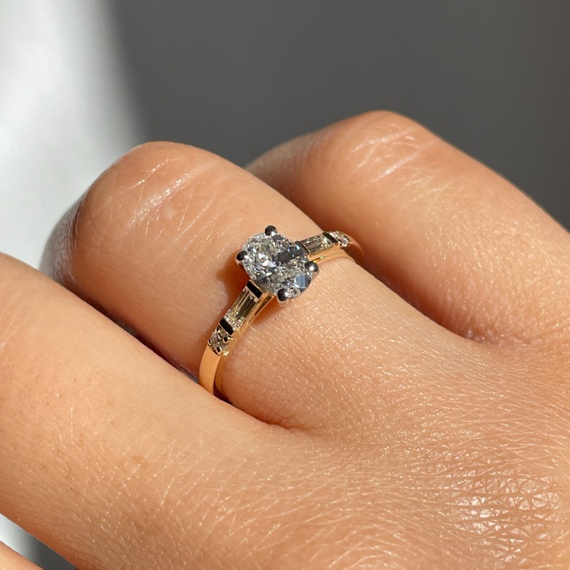 Round Shape and Tapered Baguettes Diamond Engagement Ring