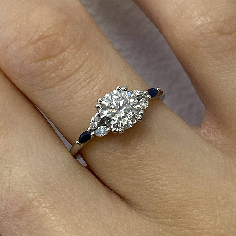 Round diamond with sapphire side stones hotsell