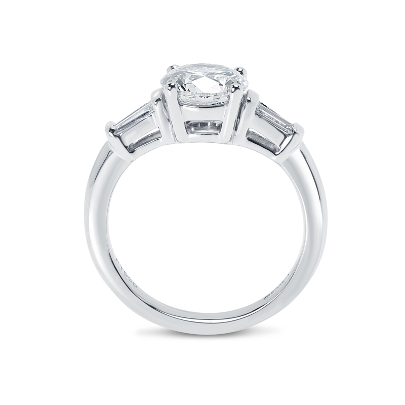 Round Shape And Tapered Baguettes Diamond Engagement Ring