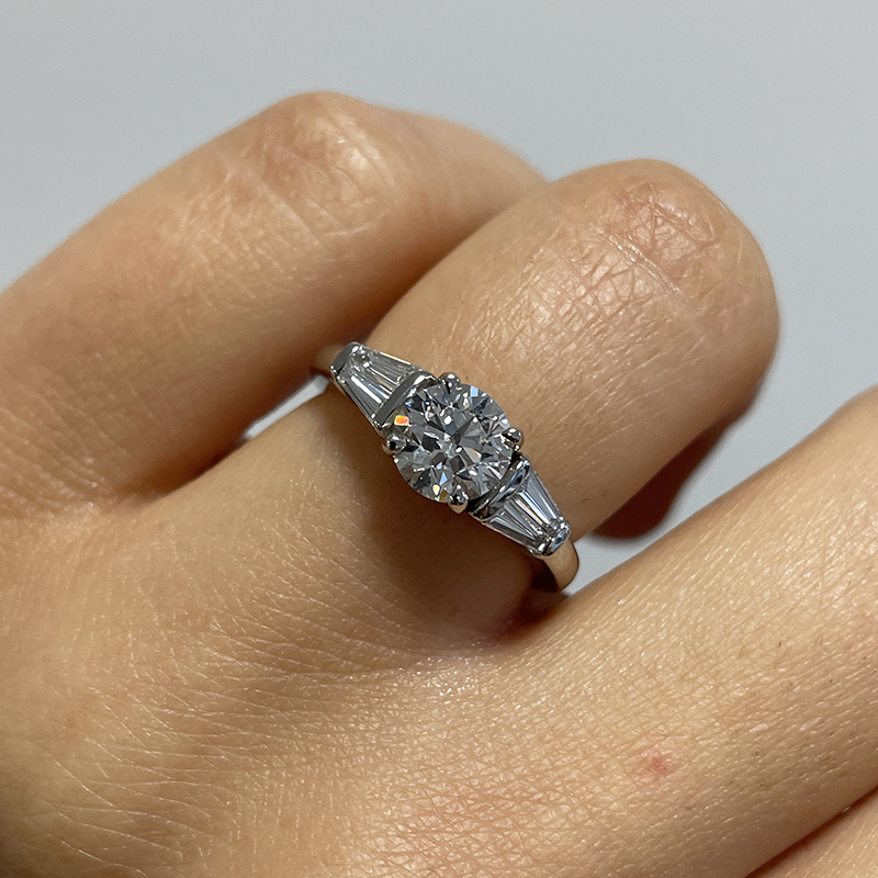 Round Shape And Tapered Baguettes Diamond Engagement Ring