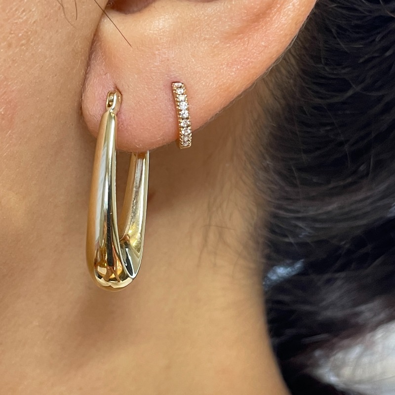 Elongated hoop earrings top