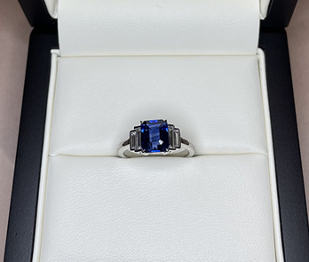 Blue Sapphire Emerald Cut And Side Baguettes Engagement Ring