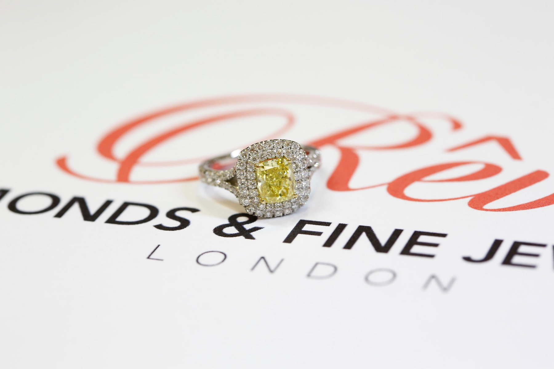 Fancy yellow cushion cut halo diamond ring Fancy yellow cushion cut halo diamond ring